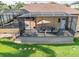 Backyard patio with comfortable seating and a screened-in pool, ideal for outdoor living and entertaining at 6357 Ashley Dr, Lakeland, FL 33813