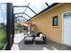 The outdoor patio features a seating area with umbrella and views of the backyard at 6357 Ashley Dr, Lakeland, FL 33813