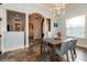 Dining room featuring wainscoting, chandelier, tile floors, and view into the foyer and hallway at 6357 Ashley Dr, Lakeland, FL 33813