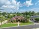 Attractive single-Gathering home with beautiful landscaping, mature trees, and a well-manicured lawn at 6357 Ashley Dr, Lakeland, FL 33813