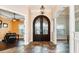 Grand foyer with decorative tile flooring, arched doorways, and elegant columns leading to other rooms at 6357 Ashley Dr, Lakeland, FL 33813
