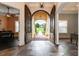 Spacious foyer with open double doors offering a view of the landscaped front yard and brick walkway at 6357 Ashley Dr, Lakeland, FL 33813