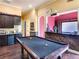 Entertaining game room boasts a pool table, a wet bar, and a media space for movies and fun at 6357 Ashley Dr, Lakeland, FL 33813