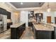 Gourmet kitchen boasts granite countertops, stainless steel appliances, and custom cabinetry at 6357 Ashley Dr, Lakeland, FL 33813