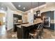 Gourmet kitchen boasts granite countertops, stainless steel appliances, and custom cabinetry at 6357 Ashley Dr, Lakeland, FL 33813