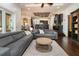 Open-concept living area with modern furnishings, wood floors, and great natural light at 6357 Ashley Dr, Lakeland, FL 33813