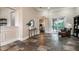 Open living room with tile flooring, columns, and access to outdoor patio at 6357 Ashley Dr, Lakeland, FL 33813