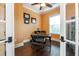 Home office featuring hardwood floors, a modern desk, and bright natural light from a window at 6357 Ashley Dr, Lakeland, FL 33813