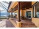 Covered outdoor living space with brick flooring, wood ceiling, and ceiling fans at 6357 Ashley Dr, Lakeland, FL 33813