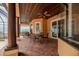 Covered outdoor living space with brick flooring, wood ceiling, and a ceiling fan at 6357 Ashley Dr, Lakeland, FL 33813