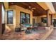 Covered outdoor living area with wood ceilings, brick patio, and comfortable seating at 6357 Ashley Dr, Lakeland, FL 33813