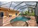 Backyard screened in pool with waterfall, patio, and jacuzzi features at 6357 Ashley Dr, Lakeland, FL 33813