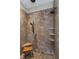 Spacious tiled shower featuring multiple shower heads and a built-in bench at 6357 Ashley Dr, Lakeland, FL 33813
