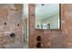 Modern shower featuring elegant tiling, detailed accents, and sleek fixtures for a luxurious bathroom experience at 6357 Ashley Dr, Lakeland, FL 33813
