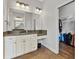 Bathroom vanity featuring granite countertop, ample storage and adjacent closet at 6542 Eagle Ridge Way, Lakeland, FL 33813