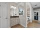 Bathroom showcasing a vanity with granite countertops and an arched entrance to tub at 6542 Eagle Ridge Way, Lakeland, FL 33813