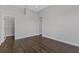 Bedroom featuring hardwood floors and an attached walk-in closet at 6542 Eagle Ridge Way, Lakeland, FL 33813