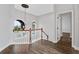 Upstairs foyer area featuring wood floors, chandelier, and natural light at 6542 Eagle Ridge Way, Lakeland, FL 33813