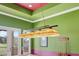 A game room featuring a vintage pool table light above a pool table and score board with a door to outside at 6542 Eagle Ridge Way, Lakeland, FL 33813