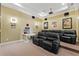 Home theater with projector, screen, movie themed decor, and reclining leather seating at 6542 Eagle Ridge Way, Lakeland, FL 33813