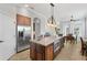 Kitchen featuring an island with seating, stainless steel appliances, recessed lighting, and an eat-in dining area at 6542 Eagle Ridge Way, Lakeland, FL 33813