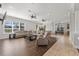 Spacious living room with hardwood flooring, neutral paint, and lots of natural light at 6542 Eagle Ridge Way, Lakeland, FL 33813