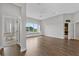 Bright living room with hardwood floors and large windows overlooking the landscape at 6542 Eagle Ridge Way, Lakeland, FL 33813