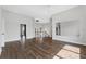 Open-concept living room with wood floors and lots of natural light at 6542 Eagle Ridge Way, Lakeland, FL 33813