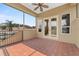 A relaxing outdoor patio featuring a textured tile floor and double french doors at 6542 Eagle Ridge Way, Lakeland, FL 33813