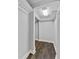 Unfinished storage area with overhead lighting and hardwood-style flooring at 6542 Eagle Ridge Way, Lakeland, FL 33813
