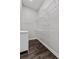 Walk-in closet with white wire shelving and dark hardwood floors at 6542 Eagle Ridge Way, Lakeland, FL 33813