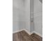Walk-in closet with white wire shelving and dark hardwood floors at 6542 Eagle Ridge Way, Lakeland, FL 33813