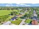 Aerial view of residential neighborhood surrounded by lush greenery and waterways at 6543 Tula Ln, Lakeland, FL 33809