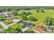 Aerial shot of a house situated in a residential neighborhood with a large field at 6543 Tula Ln, Lakeland, FL 33809