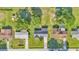 An aerial view of three residential homes with driveways and well-maintained lawns at 6543 Tula Ln, Lakeland, FL 33809