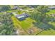 Aerial view of home with screened-in porch and sprawling fenced backyard with trees at 6543 Tula Ln, Lakeland, FL 33809