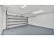 Empty garage with gray floor and open overhead door ready for vehicles or storage at 6543 Tula Ln, Lakeland, FL 33809
