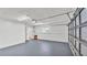 Spacious garage with newly painted walls and floor at 6543 Tula Ln, Lakeland, FL 33809