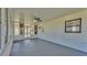 Covered and screened outdoor patio featuring a ceiling fan at 6543 Tula Ln, Lakeland, FL 33809