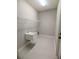 New laundry room with utility sink, overhead rack and tile floors at 7919 Lake James Blvd, Lakeland, FL 33810