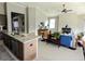Open-concept layout connecting kitchen and living room, with fireplace, stylish decor, and bright natural light at 7919 Lake James Blvd, Lakeland, FL 33810