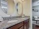 Bathroom featuring a double sink vanity with granite countertops at 13525 Gorgona Isle Dr, Windermere, FL 34786