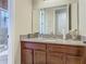 Bathroom featuring a wooden vanity with granite countertop at 13525 Gorgona Isle Dr, Windermere, FL 34786
