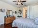 Spacious bedroom with hardwood floors, double closet, and natural light at 13525 Gorgona Isle Dr, Windermere, FL 34786