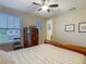 Bedroom features a bed, hardwood floors, and natural light at 13525 Gorgona Isle Dr, Windermere, FL 34786