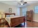 Bedroom features a wood-framed bed and hardwood floors at 13525 Gorgona Isle Dr, Windermere, FL 34786