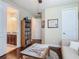 Cozy bedroom offering an adjacent bathroom and natural light at 13525 Gorgona Isle Dr, Windermere, FL 34786