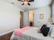 Comfortable bedroom with ceiling fan and en-suite bathroom access at 13525 Gorgona Isle Dr, Windermere, FL 34786