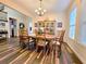 Traditional dining room featuring wood floors and a large hutch at 13525 Gorgona Isle Dr, Windermere, FL 34786
