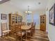 Cozy dining room with decorative china cabinet and natural lighting at 13525 Gorgona Isle Dr, Windermere, FL 34786